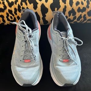 Light blue/ Navy HOKA running shoes with coral accents. Size 8